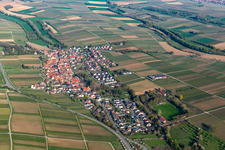 Drone image of Agricultural land and field borders surround the settlement area of the village in Wollmesheim in the state Rhineland-Palatinate, Germany