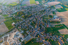 Village - view on the edge of agricultural fields and farmland in Sessenheim in Grand Est, France