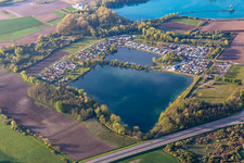 Camping with caravans and tents in Friesenheim at the Schuttern quarry pond in the state Baden-Wurttemberg, Germany