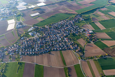Aerial view of Agricultural land and field boundaries surround the settlement area of the village in Schuttern in the state Baden-Wuerttemberg, Germany