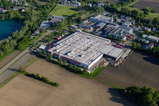 Oblique view of Building and production halls on the premises of Coca-Cola European Partners Deutschland GmbH in Neureut in the state Baden-Wuerttemberg, Germany