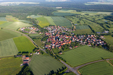 Aerial photograpy of Village view on the edge of agricultural fields and land in Loeffelsterz in the state Bavaria, Germany