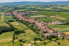 Village view on the edge of agricultural fields and land in Freckenfeld in the state Rhineland-Palatinate, Germany