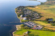 Pleasure boat marina of CLUB NAUTIC e.V. with docks and moorings on the shore area of the Foerde with Restaurant "Leuchtturm" in Schausende in Gluecksburg in the state Schleswig-Holstein, Germany