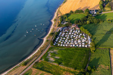 Campsite Habernis with caravans and tents on the shore of Baltic Sea in Steinberg in the state Schleswig-Holstein, Germany
