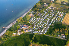 Aerial view of Campsite nordstern with caravans and tents on the baltic sea shore on Seebadeanstalt Norgaardholz in Norgaardholz in the state Schleswig-Holstein, Germany