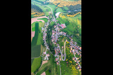 Aerial photograpy of Agricultural land and field boundaries surround the settlement area of the village in Lombach in the state Baden-Wuerttemberg, Germany