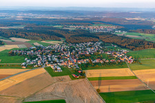 Aerial view of Agricultural land and field boundaries surround the settlement area of the village in Marschalkenzimmern in the state Baden-Wuerttemberg, Germany