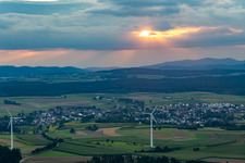 Place at sunset from the east behind wind turbines in the district Waldmössingen in Schramberg in the state Baden-Wuerttemberg, Germany