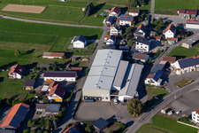 Oblique view of Building and production halls on the premises of Beurer GmbH in Uttenweiler in the state Baden-Wuerttemberg, Germany