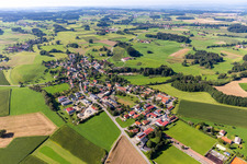 Agricultural land and field boundaries surround the settlement area of the village in Wetzisreute in the state Baden-Wuerttemberg, Germany