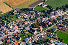 Town View of the streets and houses of the residential areas with with Town hall and Church St. Konrad in Langenenslingen in the state Baden-Wuerttemberg, Germany