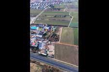 Drone recording of In der Nauroth commercial area in Ellerstadt in the state Rhineland-Palatinate, Germany