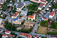 Aerial view of Church of the Annunciation and PhysioKlinik im Aitrachtal GmbH in the district Weichshofen in Mengkofen in the state Bavaria, Germany