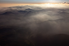 The 3 castles: Münz, Anebos and Trifels in the haze from the north in the district Queichhambach in Annweiler am Trifels in the state Rhineland-Palatinate, Germany