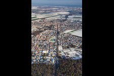 Aerial view of Kandelerstraße in winter with snow in Rheinzabern in the state Rhineland-Palatinate, Germany