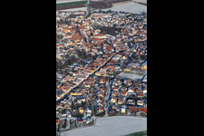 Aerial view of Main street with parish church of St. Michael in winter with snow in Rheinzabern in the state Rhineland-Palatinate, Germany