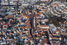 Aerial photograpy of Main street with parish church of St. Michael in winter with snow in Rheinzabern in the state Rhineland-Palatinate, Germany