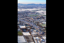 Aerial view of Lower main street in winter with snow in Herxheim bei Landau in the state Rhineland-Palatinate, Germany