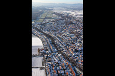 Ketteler Straße in winter with snow in Herxheim bei Landau in the state Rhineland-Palatinate, Germany