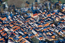 Aerial view of Church of St. Martin in winter with snow in Steinweiler in the state Rhineland-Palatinate, Germany