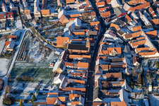 Aerial view of Protestant church in winter with snow in Steinweiler in the state Rhineland-Palatinate, Germany