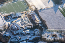 Aerial view of Holzwerk ORTH in winter with snow in the district Schaidt in Wörth am Rhein in the state Rhineland-Palatinate, Germany