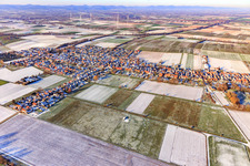 View of the town from the southeast in winter with snow in Freckenfeld in the state Rhineland-Palatinate, Germany