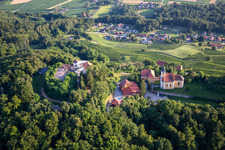 Oblique view of Church of Župnijska cerkev sv. Marije Vnebovzete and Café Huda Liza on the Vurberg in Duplek in the state Slovenia, Slovenia
