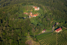 Aerial photograpy of Church of Župnijska cerkev sv. Marije Vnebovzete and Café Huda Liza above the Vurberg vineyards in Duplek in the state Slovenia, Slovenia