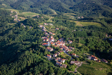 Aerial photograpy of Hilltop village between vineyards and forest in Nova Gorica in the state Slovenia, Slovenia