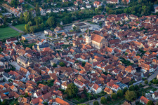 Rue du Gén de Gaulle with Eglise catholique Saint-Etienne from the northeast in Rosheim in the state Bas-Rhin, France