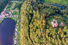 Neudahn Castle ruins above the Neudahner Weiher campsite in Dahn in the state Rhineland-Palatinate, Germany from the plane