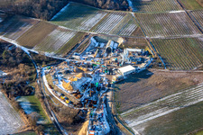Aerial photograpy of Construction site of the tunnel portal east for the Astrid Tunnel for the underpass and bypass of Bad Bergzabern between B38 (Weinstraße) and B427 (Kurtalstraße) in winter with snow in Dörrenbach in the state Rhineland-Palatinate, Germany