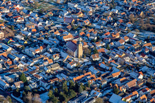 Catholic Church of St. Leodegar in winter with snow in Steinfeld in the state Rhineland-Palatinate, Germany