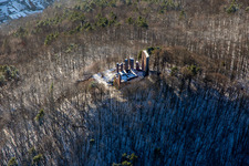 Aerial view of Ramburg castle ruins in winter with snow in Ramberg in the state Rhineland-Palatinate, Germany