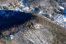 Bird's eye view of Ramburg castle ruins in winter with snow in Ramberg in the state Rhineland-Palatinate, Germany