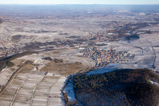 Aerial view of Keschdebusch vineyard from the west in winter with snow in Birkweiler in the state Rhineland-Palatinate, Germany