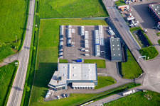 Oblique view of Industrial estate with KIMMEL LOGISTICS, KIMMEL LAVAGE, Dietrich Véhicules and Sarre Union Pl Services - MAN at the Sarre-Union toll station - A4 - Route No. 42 in Thal-Drulingen in the state Bas-Rhin, France