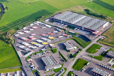 Industrial estate with KIMMEL LOGISTICS, KIMMEL LAVAGE, Dietrich Véhicules and Sarre Union Pl Services - MAN at the Sarre-Union toll station - A4 - Route No. 42 in Thal-Drulingen in the state Bas-Rhin, France from above