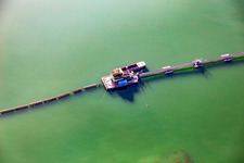 Floating dredger on the Giesen quarry lake in the district Liedolsheim in Dettenheim in the state Baden-Wuerttemberg, Germany
