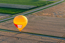 Landing of two hot air balloons "Pfalzgas in Winden in the state Rhineland-Palatinate, Germany from above