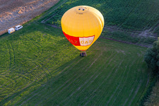Landing of two hot air balloons "Pfalzgas in Winden in the state Rhineland-Palatinate, Germany from the plane