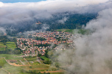 Village on the edge of the Pfläzerwald from the northeast under clouds in Klingenmünster in the state Rhineland-Palatinate, Germany