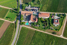 Oblique view of 4-star hotel Leinsweiler courtyard between vineyards in the morning in Leinsweiler in the state Rhineland-Palatinate, Germany