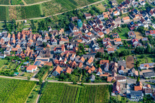 Village from the south with scaffolded Catholic parish and pilgrimage church of All Saints in Ranschbach in the state Rhineland-Palatinate, Germany