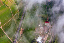 Construction site for multi-family house below the light blue Statue of Liberty on the slope of Kolchenbachstraße in Albersweiler in the state Rhineland-Palatinate, Germany