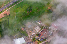 Aerial view of Construction site for multi-family house below the light blue Statue of Liberty on the slope at Kolchenbachstraße in Albersweiler in the state Rhineland-Palatinate, Germany