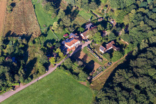Aerial view of Cramerhaus hut and game restaurant at the foot of the Lindelbrunn castle ruins in Vorderweidenthal in the state Rhineland-Palatinate, Germany