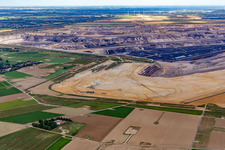 View of the Garzweiler open-cast lignite mine from the west in the district Keyenberg in Erkelenz in the state North Rhine-Westphalia, Germany
